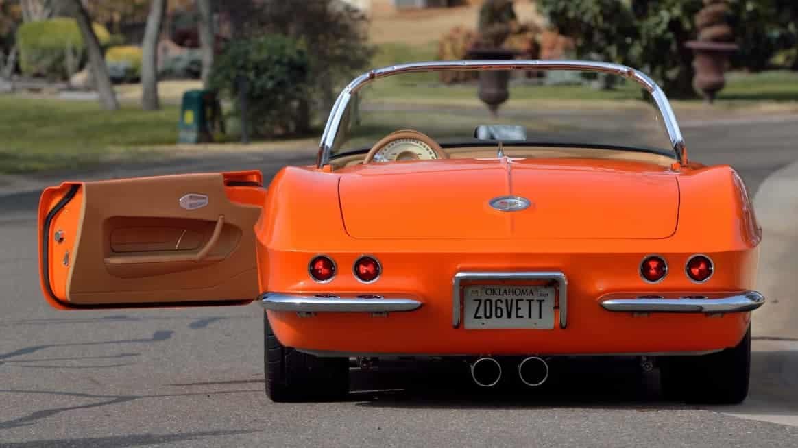 Award-winning 1961 Chevrolet Corvette Custom Rest Mod build with House of Kolor Citric-Hue Tangelo and custom Cream two-tone finish.